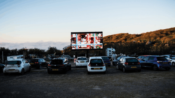 Cars waiting for screening at Wessex Cancer Support's drive in cinema