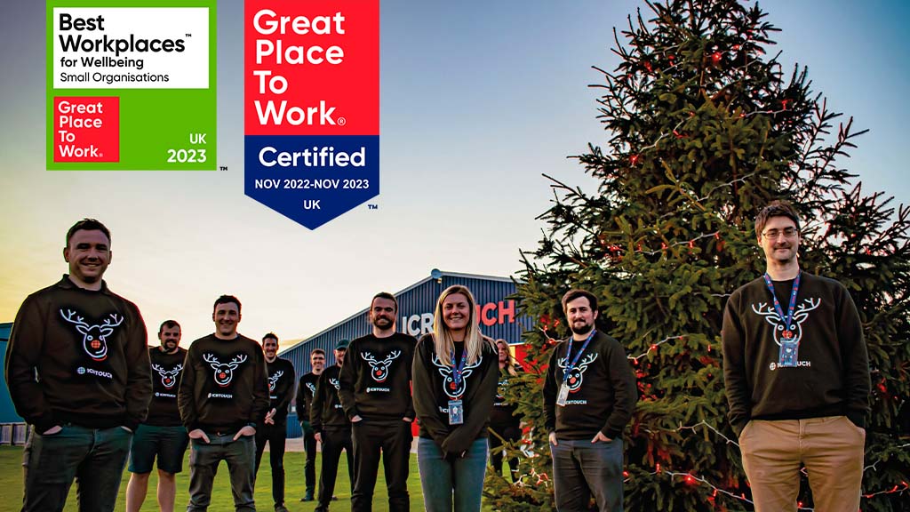Team at Christmas with Great Place To Work certification badges