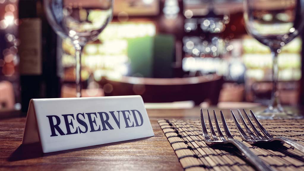 A reserved sign on a restaurant table