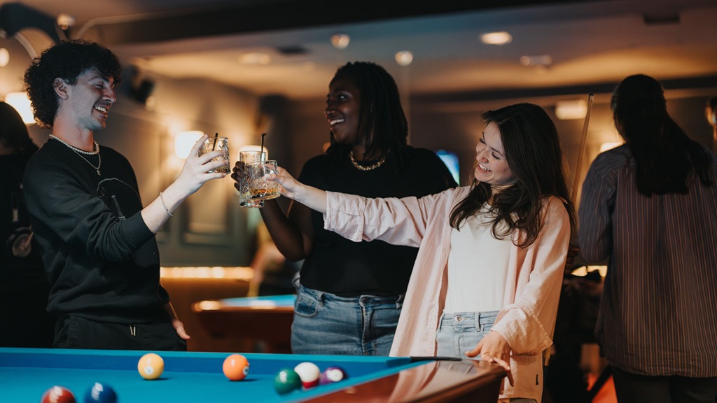 People playing pool at member club