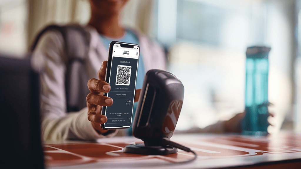 Member scanning loyalty QR code on phone