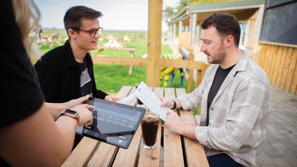 PocketTouch being used by a waitress in an outdoor area of a restaurant