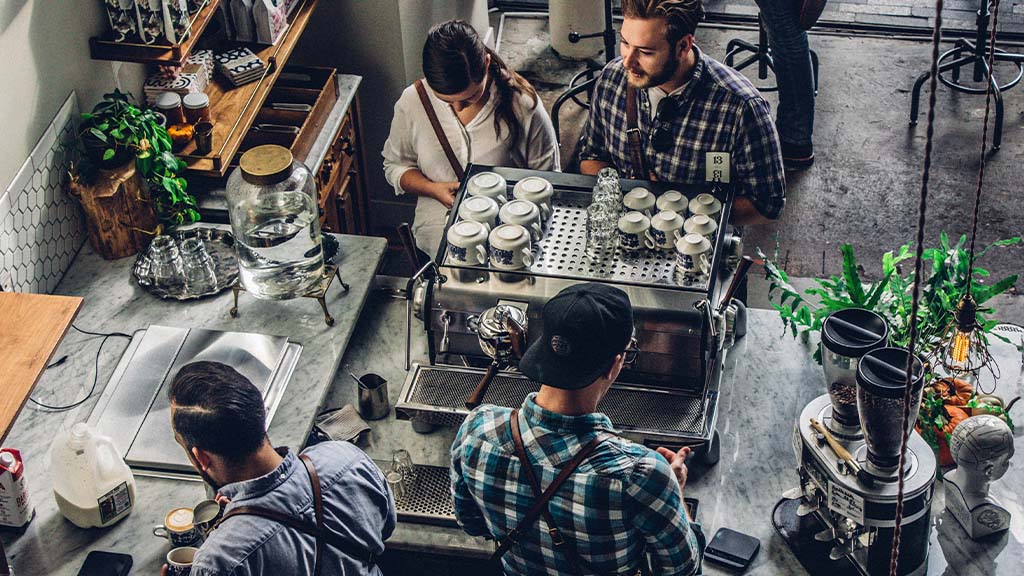 Busy team working in coffee shop