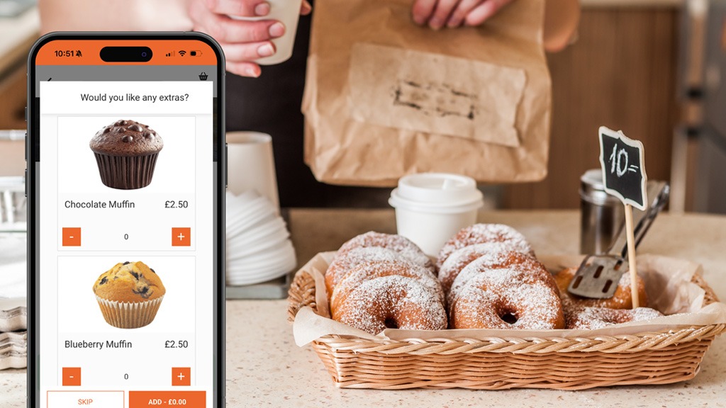Associated items on TouchTakeaway with person handing takeaway over the a customer in a coffee shop in the background